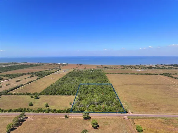 an aerial view of beach and ocean