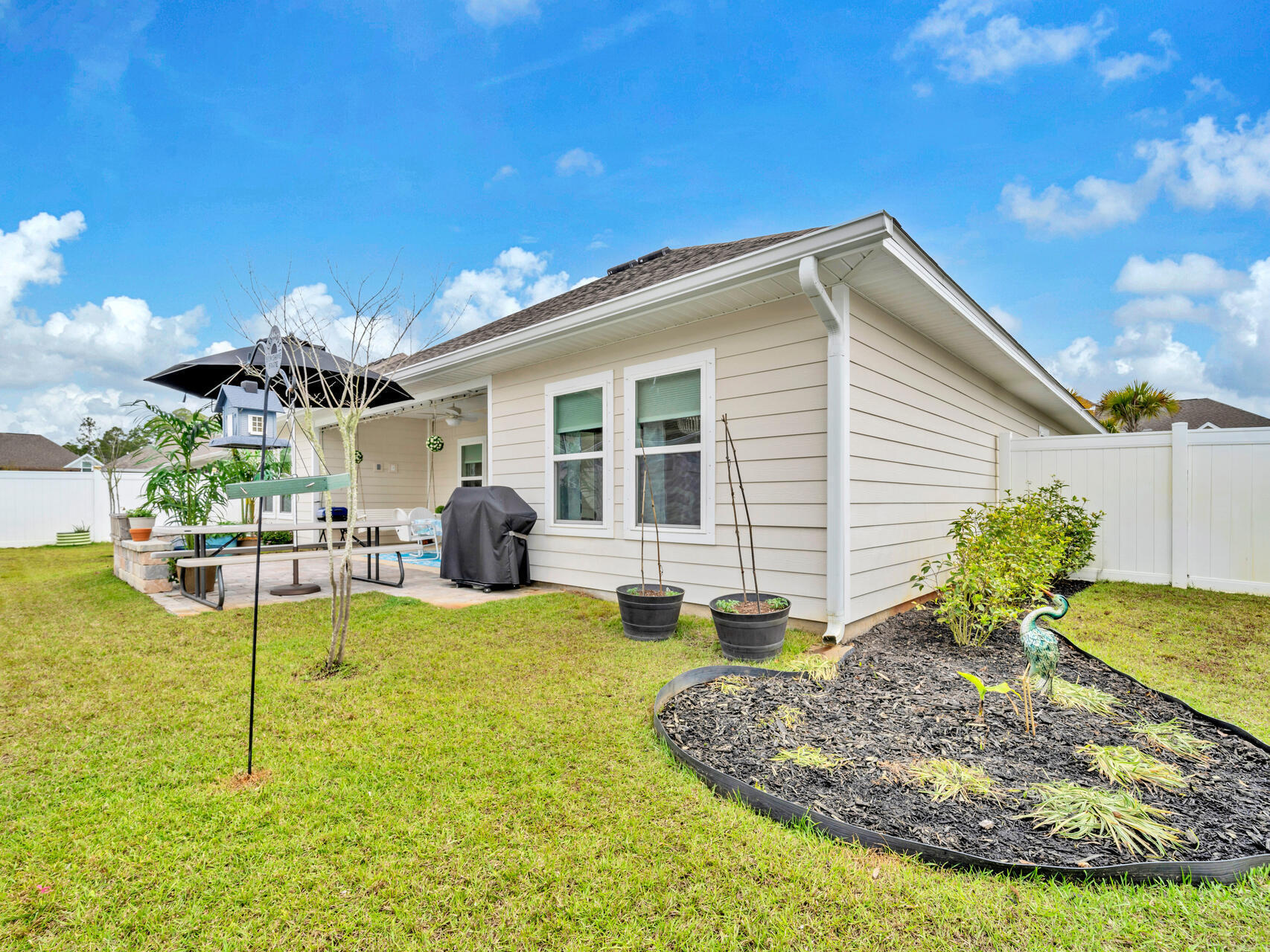 183 Pine Lake Drive Santa Rosa Beach, FL 32459 - Photo 48 of 63 a view of a house with backyard porch and sitting area