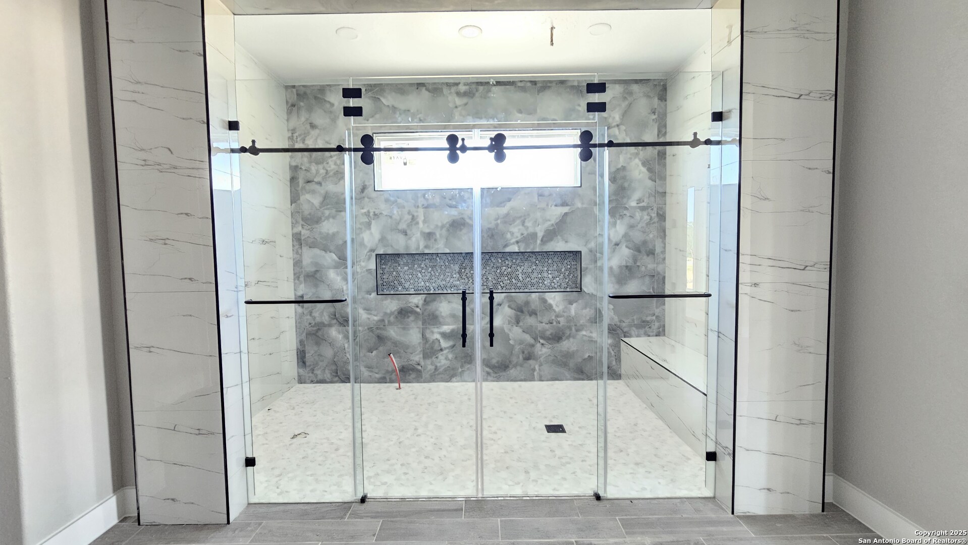 699 James Way Castroville, TX 78009 - Photo 15 of 31 a bathroom with a shower