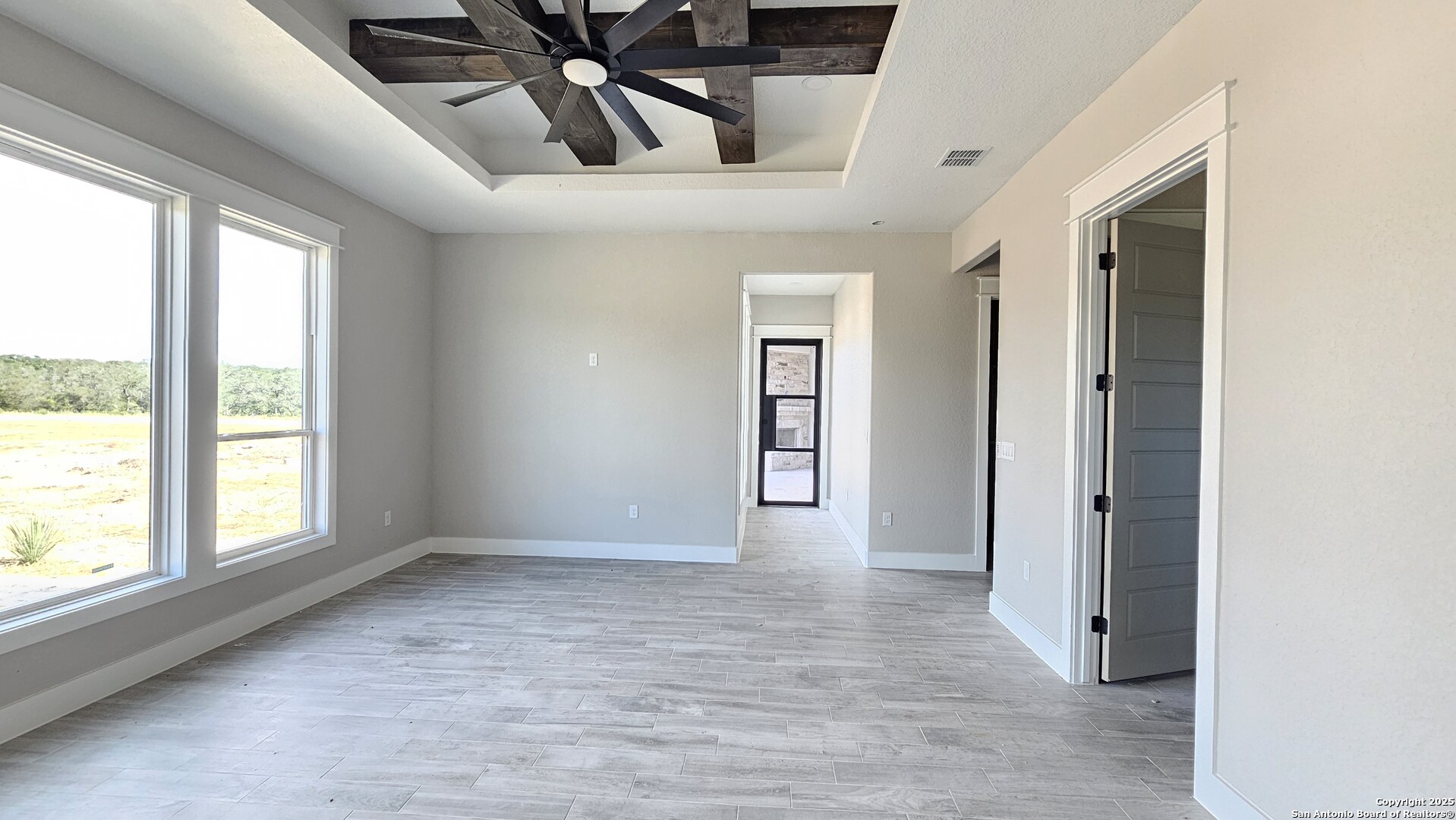 699 James Way Castroville, TX 78009 - Photo 16 of 31 an empty room with windows