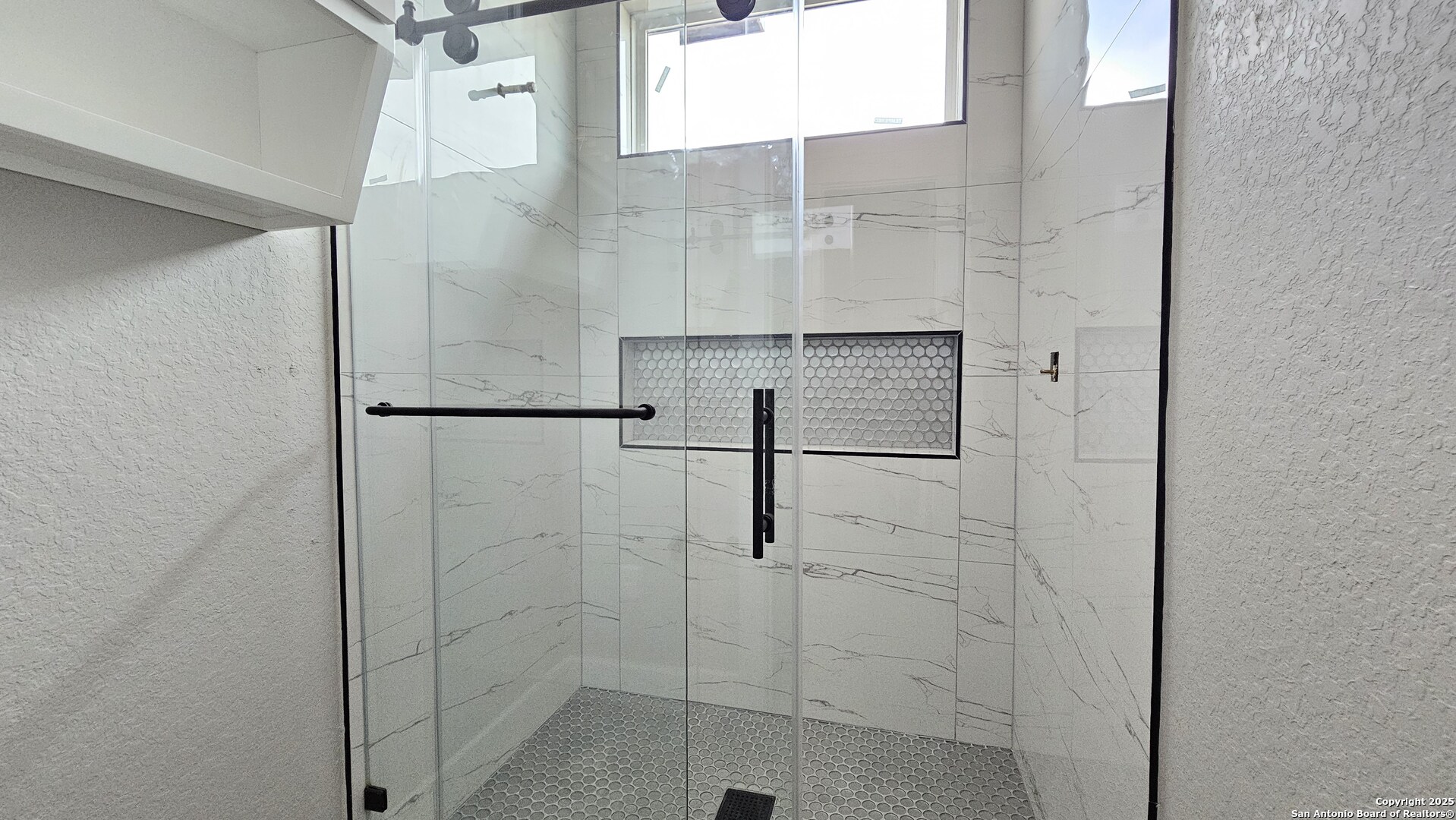 699 James Way Castroville, TX 78009 - Photo 21 of 31 a bathroom with a shower