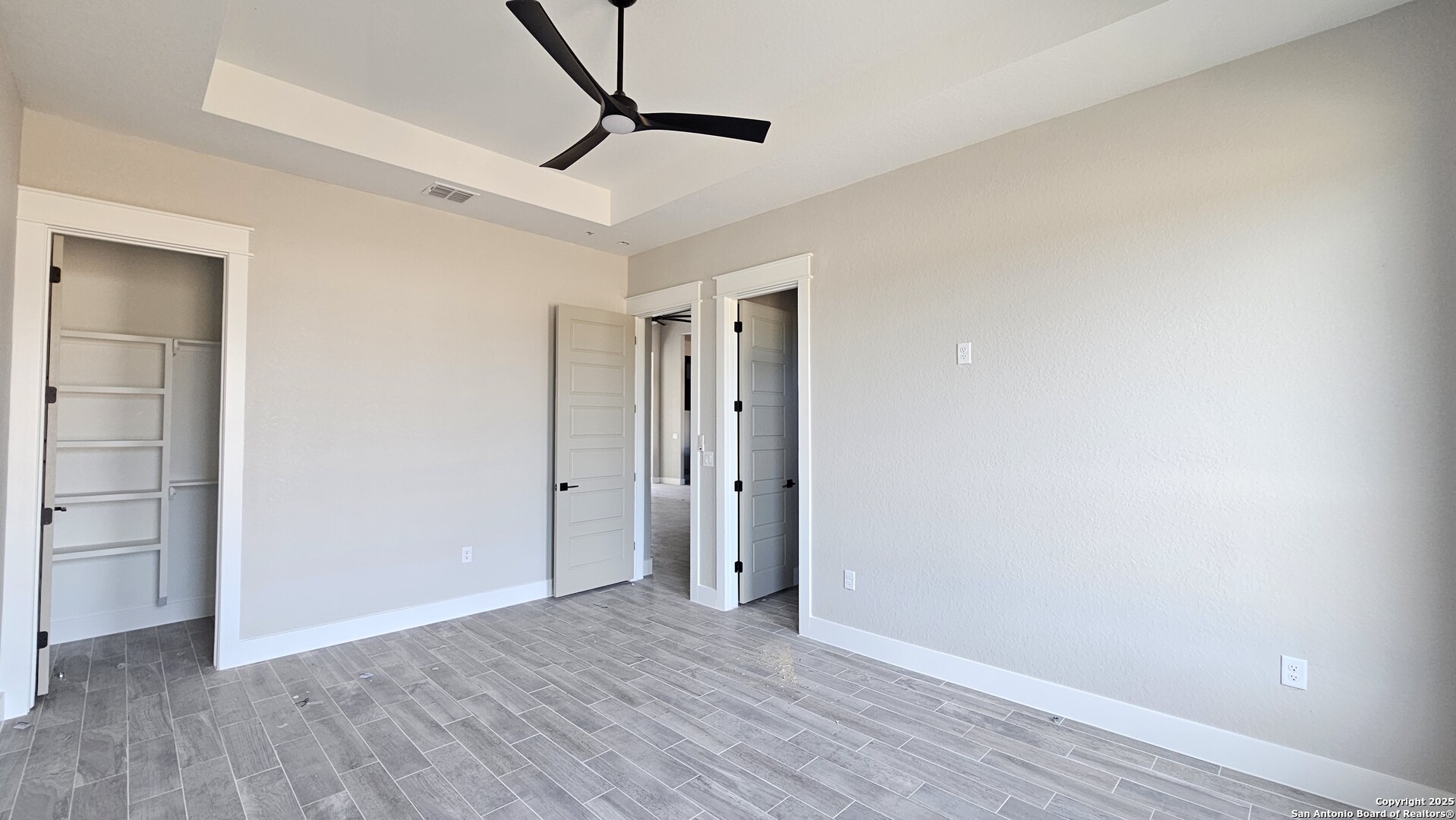 699 James Way Castroville, TX 78009 - Photo 22 of 31 a view of an empty room with wooden floor