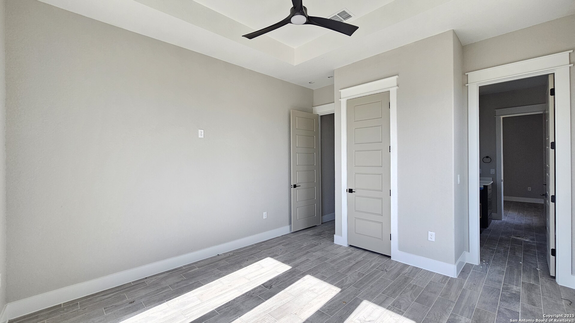 699 James Way Castroville, TX 78009 - Photo 28 of 31 wooden floor in an empty room with a window