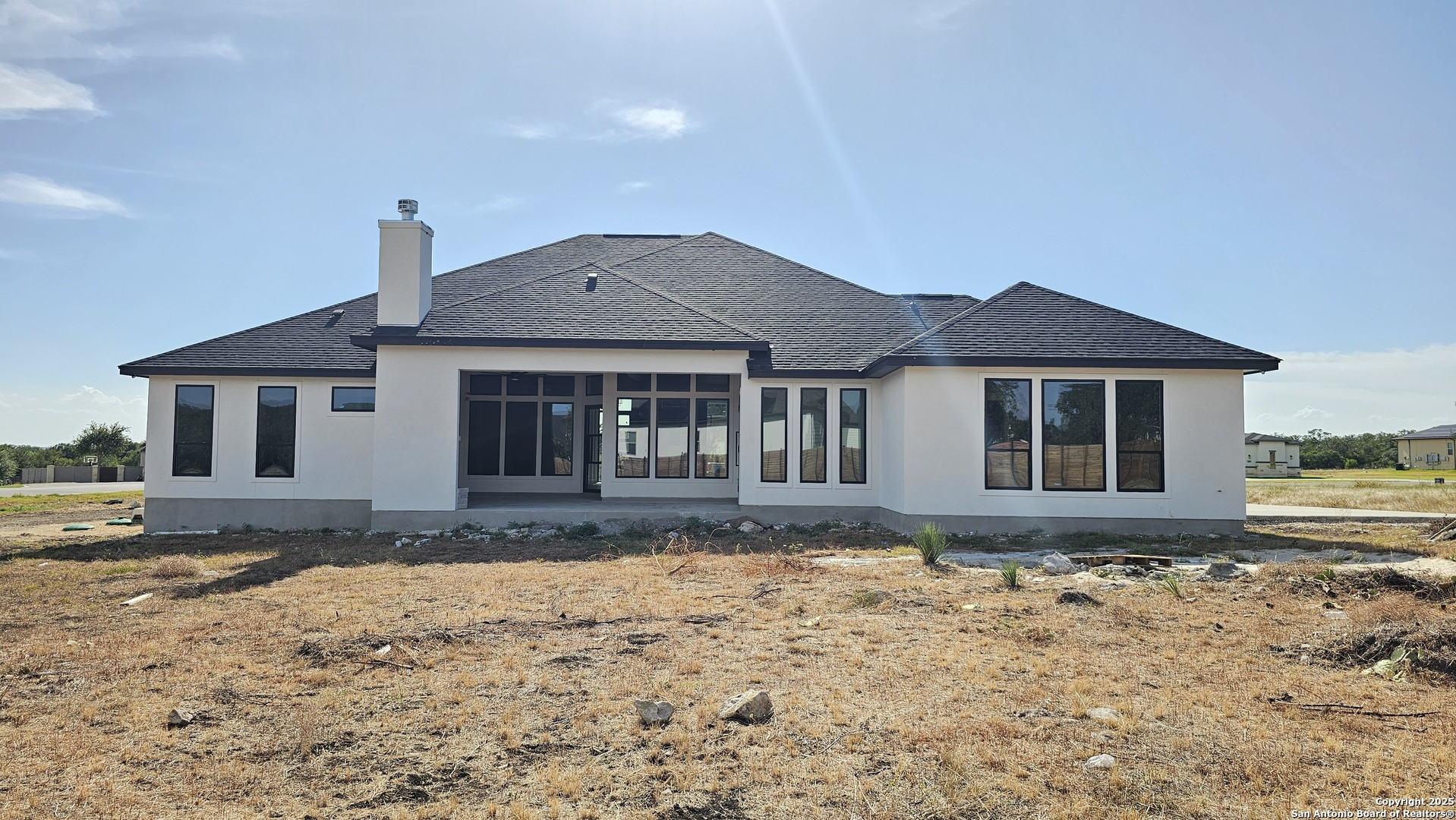 699 James Way Castroville, TX 78009 - Photo 30 of 31 a front view of a house with a yard