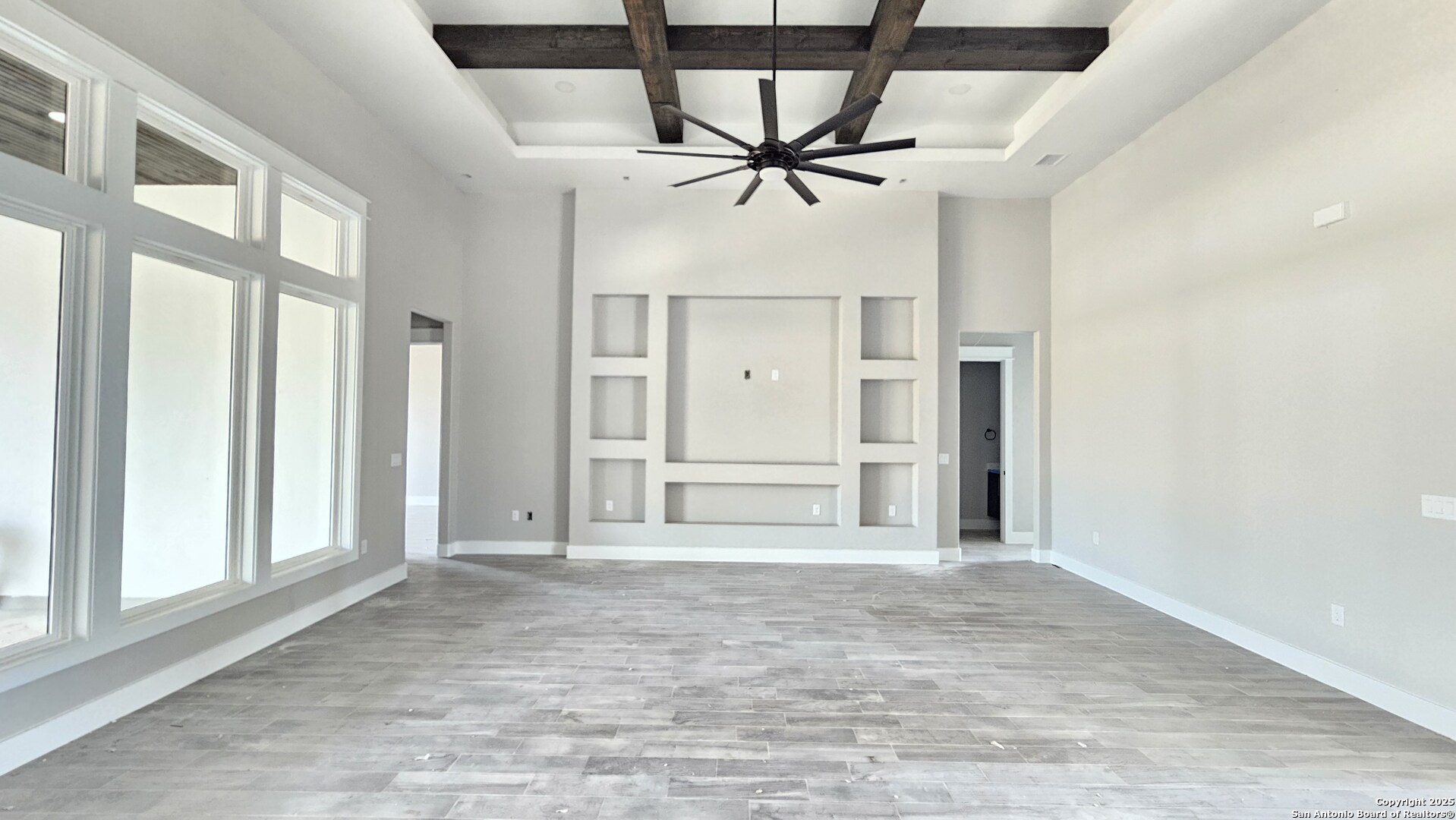 699 James Way Castroville, TX 78009 - Photo 8 of 31 a view of a livingroom with a ceiling fan and window
