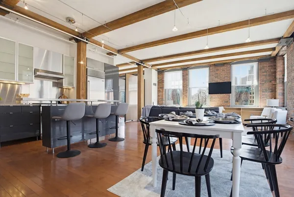 a view of a dining room with furniture window and outside view