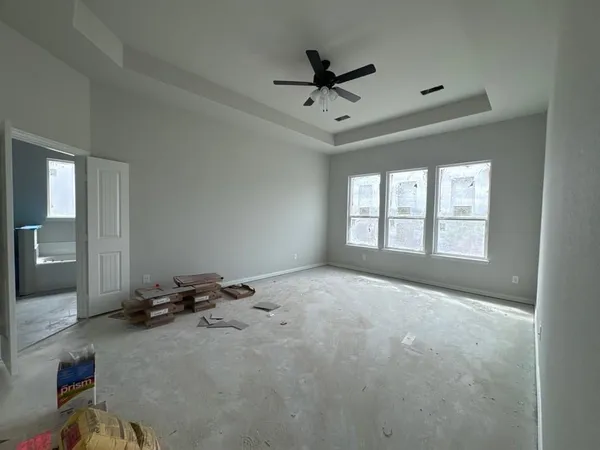 a view of an empty room and a window