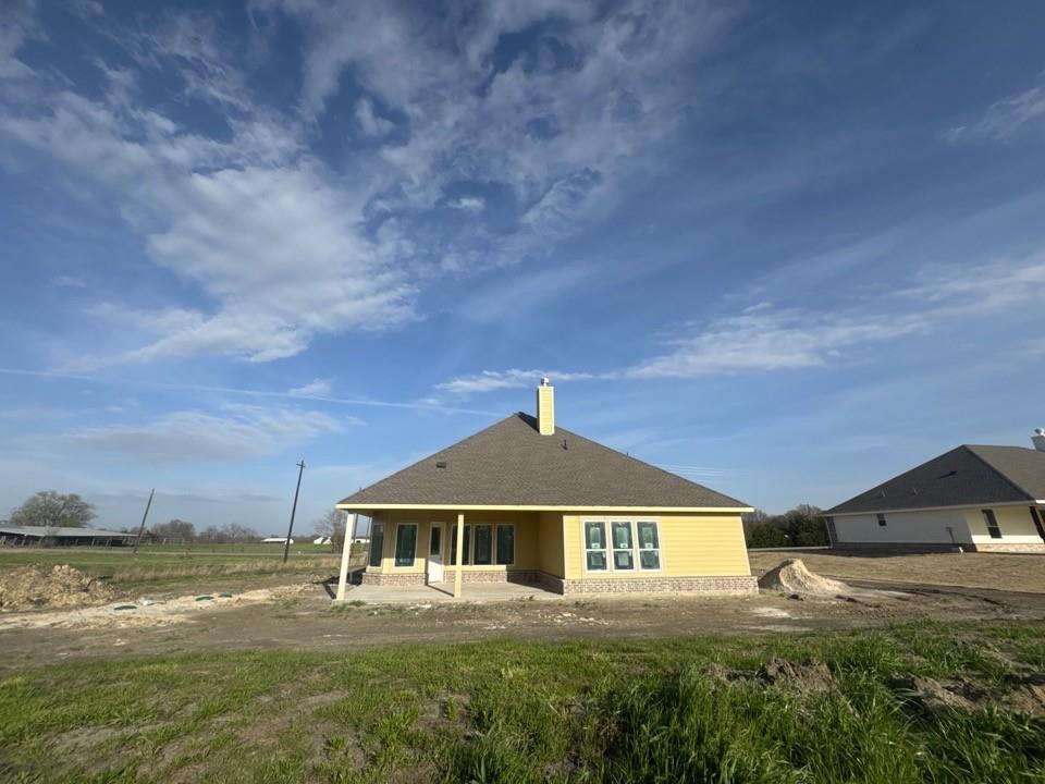8935 County Road 623 Blue Ridge, TX 75424 - Photo 19 of 20 a front view of a house with a yard