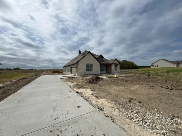 a house with trees in the background