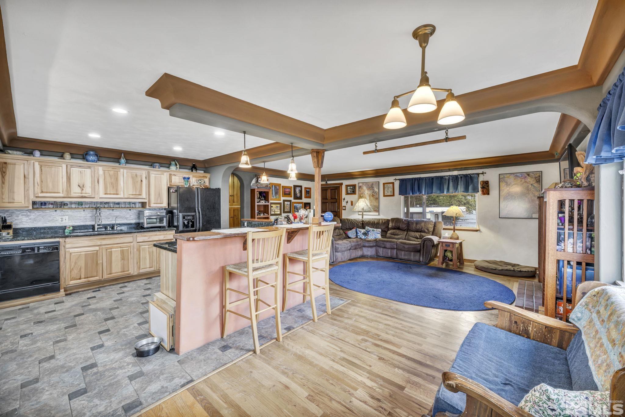 1925 Elmcrest Drive Reno, NV 89503 - Photo 28 of 32 a living room with stainless steel appliances kitchen island granite countertop furniture and a kitchen view