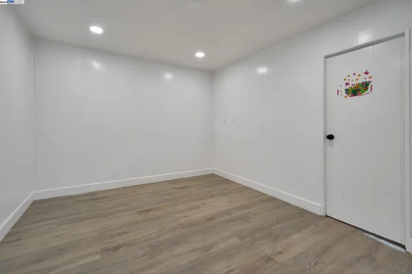 a reading room with furniture a rug and a window