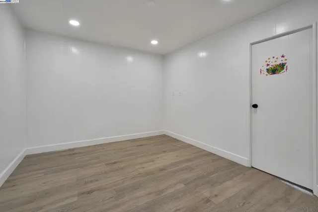 a reading room with furniture a rug and a window