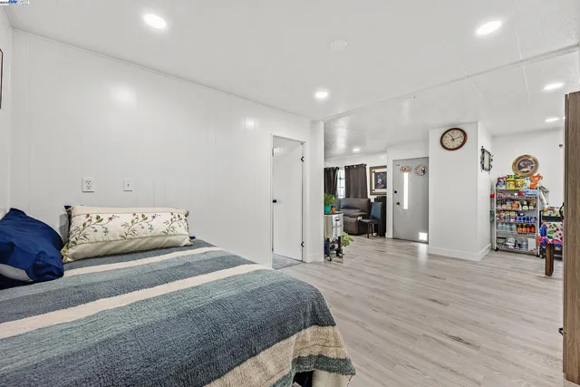 a bedroom with a bed and a dresser