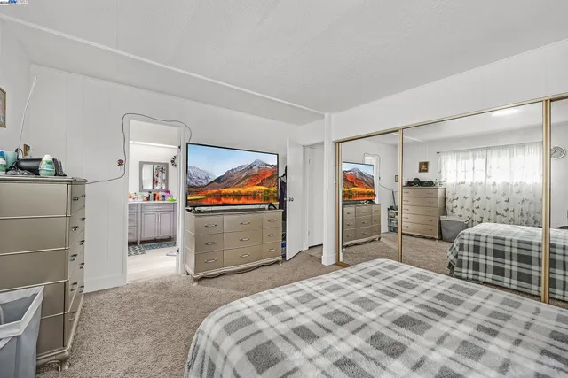 a bedroom with furniture and walk in closet