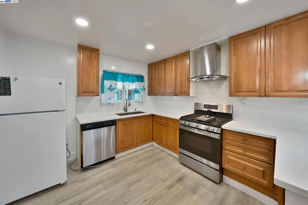 a view of kitchen with wooden floor