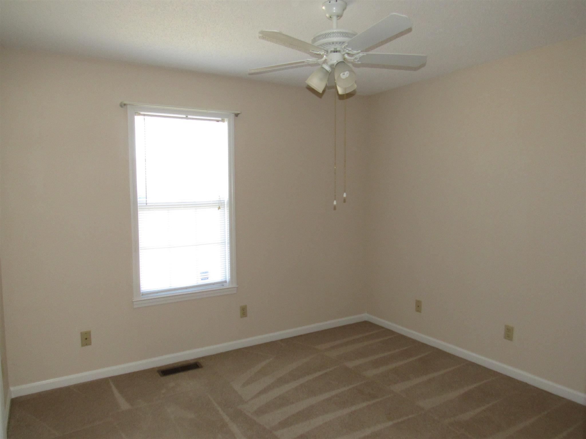 275 Jones Road Taft, TN 38488 - Photo 11 of 26 an empty room with a window