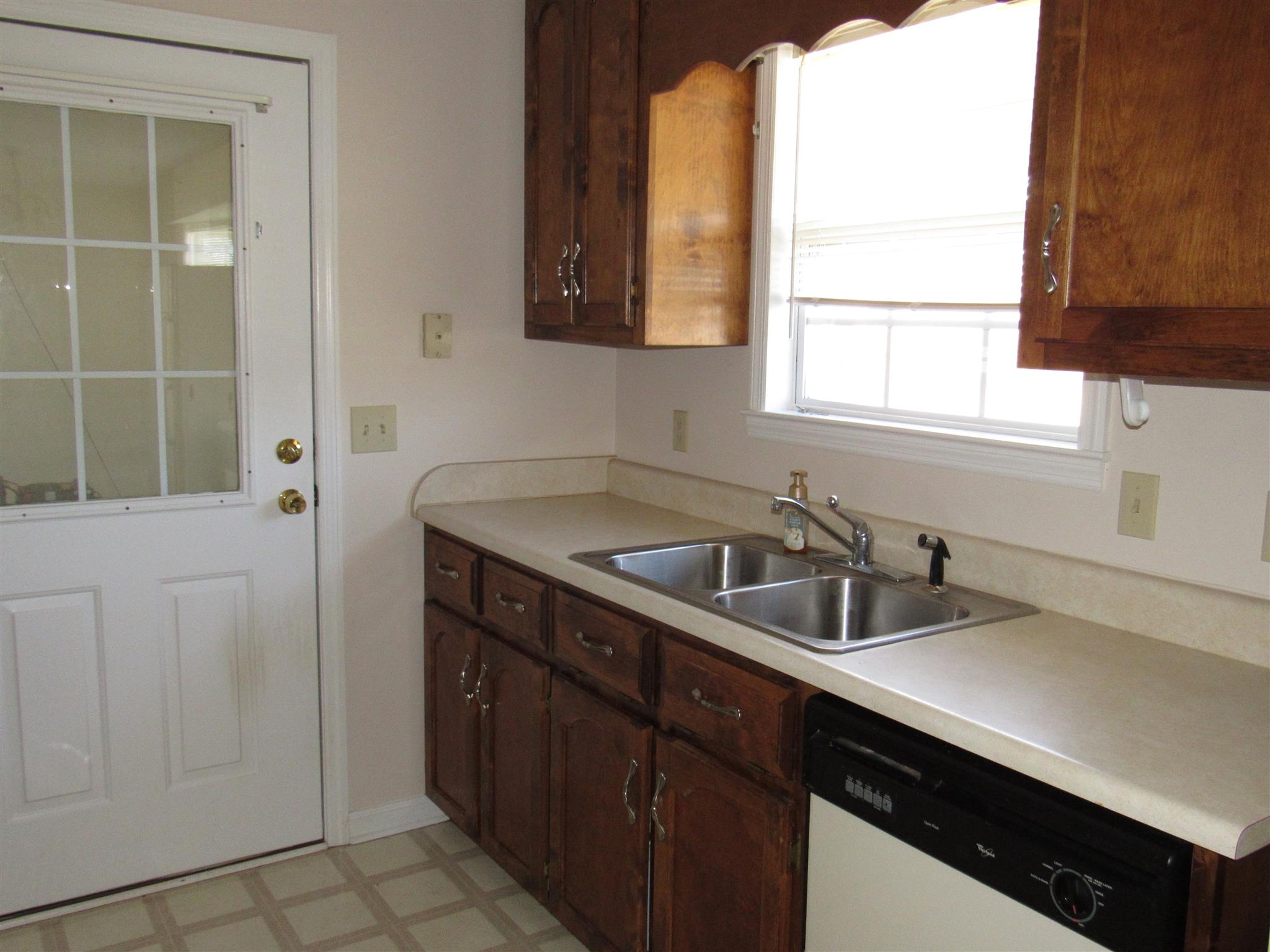 275 Jones Road Taft, TN 38488 - Photo 17 of 26 a kitchen with a sink cabinets and window