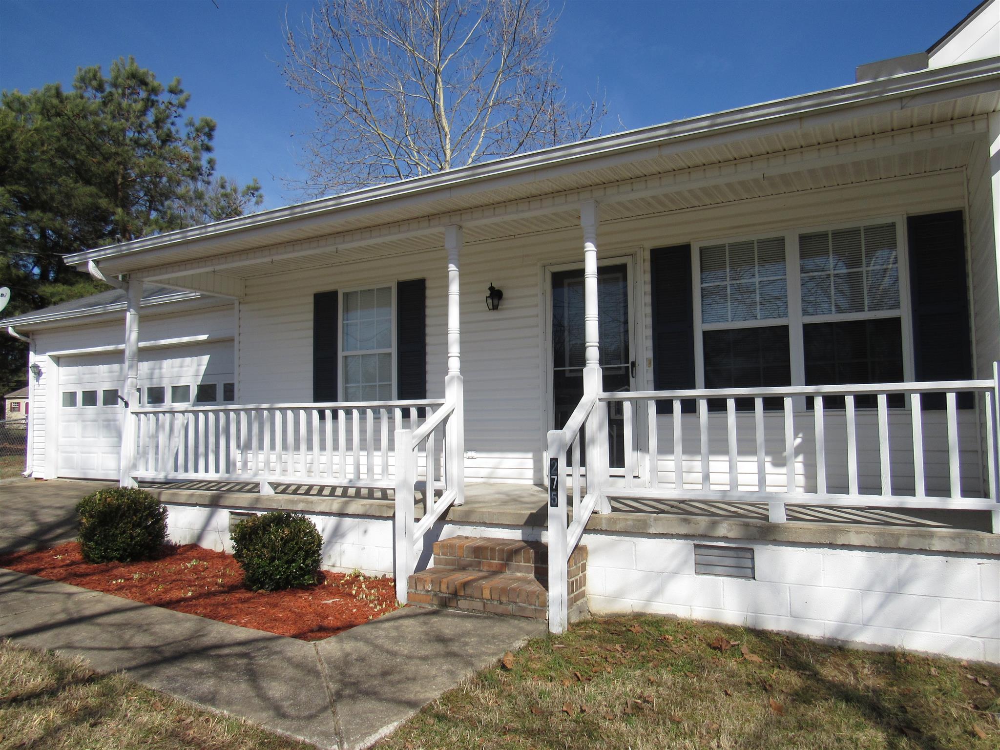 275 Jones Road Taft, TN 38488 - Photo 24 of 26 front view of a house with a swimming pool