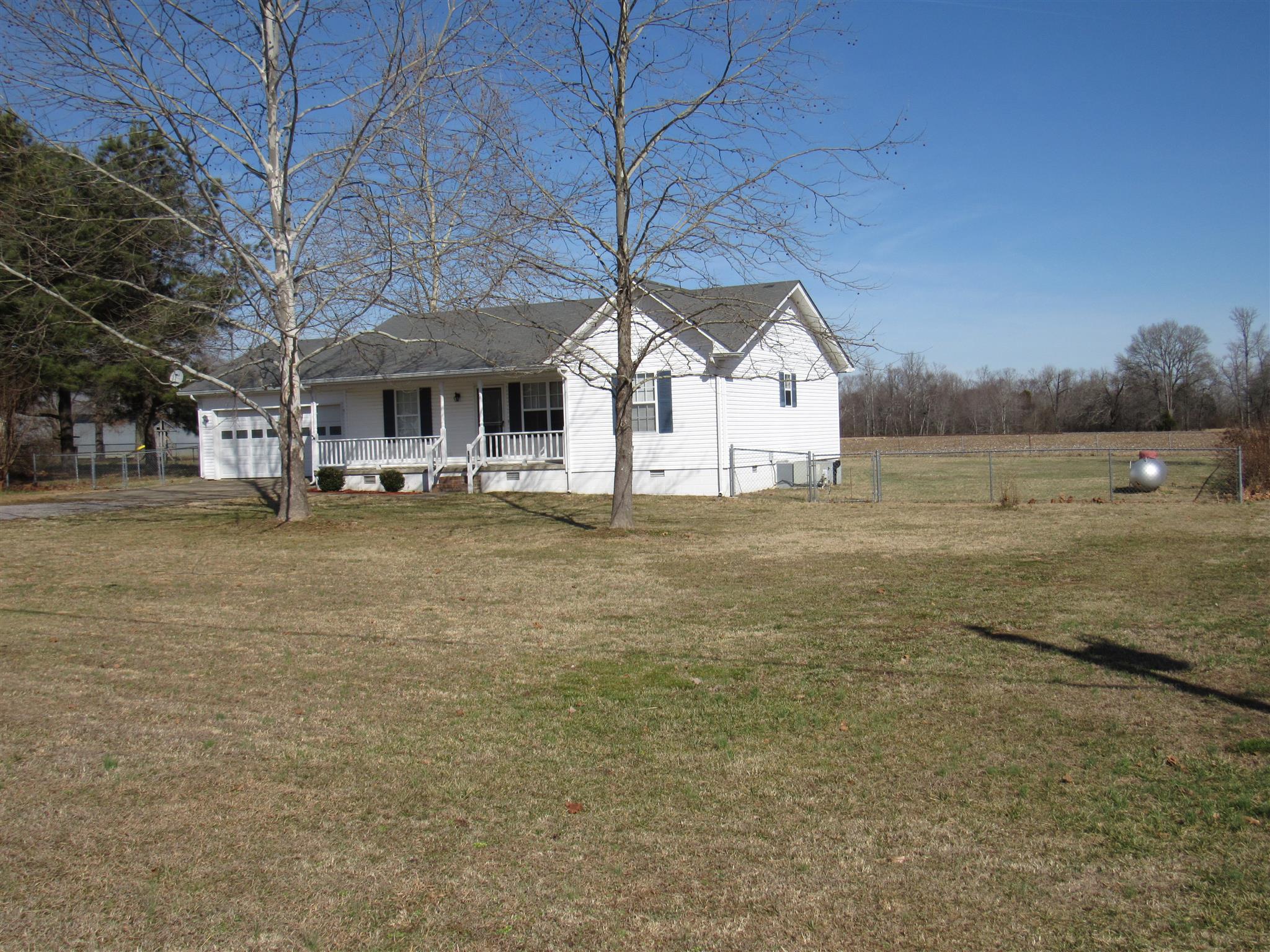 275 Jones Road Taft, TN 38488 - Photo 26 of 26 a view of a large house with a big yard and large trees