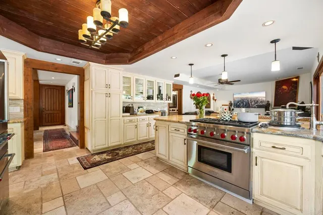 a kitchen with a table and chairs in it