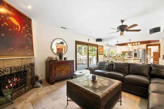 a bathroom with a granite countertop sink mirror vanity and toilet