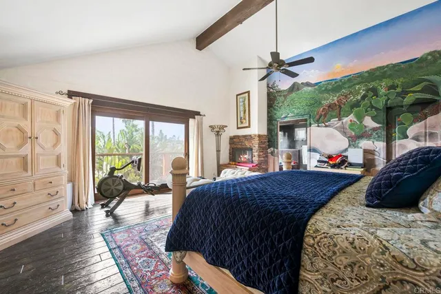 a living room with fireplace furniture and a flat screen tv