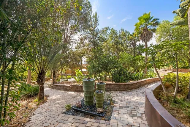 an outdoor space with furniture and umbrella