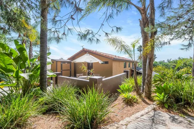 a kitchen with stainless steel appliances granite countertop a refrigerator a sink a stove a refrigerator and cabinets