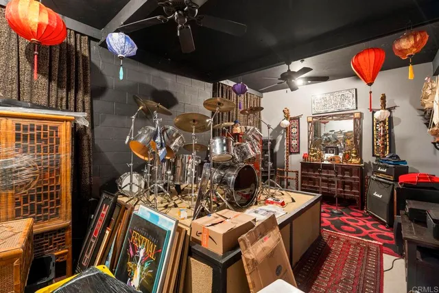 an aerial view of residential houses with outdoor space and trees