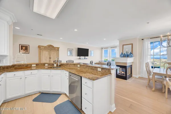 a kitchen with stainless steel appliances granite countertop a stove and a sink