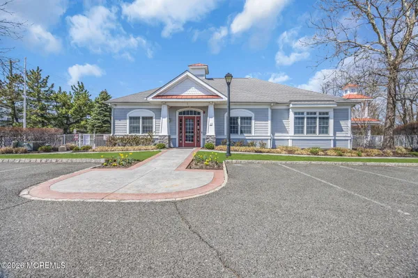 a view of a house with a swimming pool and a yard