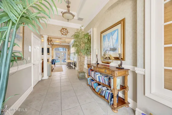 a hall way with furniture and a window