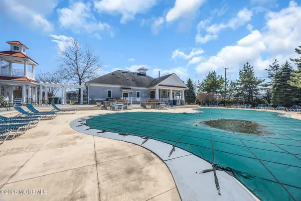 a view of a street with a house in the background
