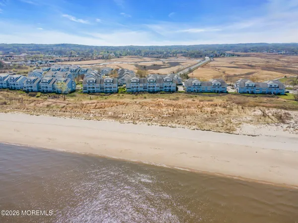 a view of an ocean and city