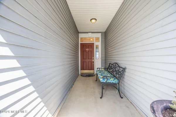 a yellow house with a outdoor seating