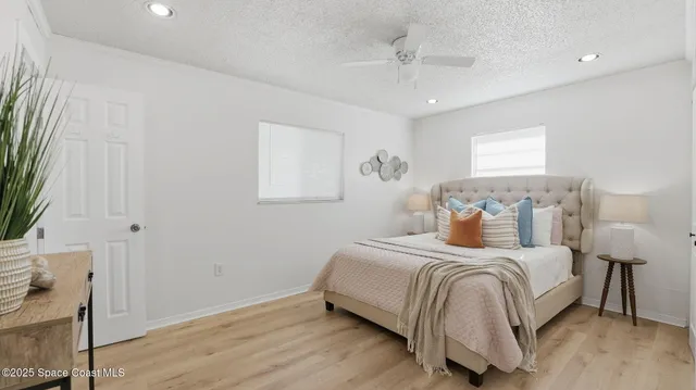 a bedroom with a bed and a night stand