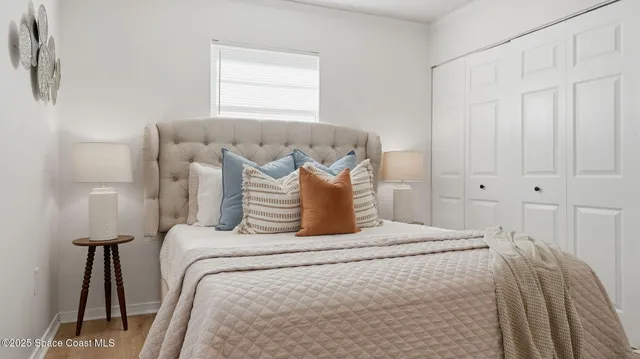 a bedroom with a bed and window