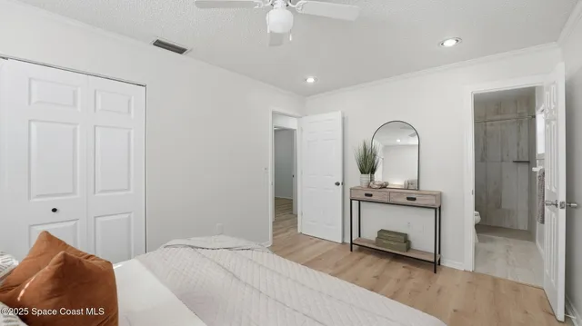 a bedroom with a bed and a mirror