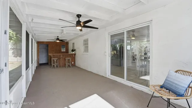 a view of room with wooden floor and furniture