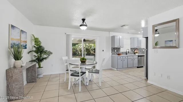 a view of kitchen with furniture and potted plant