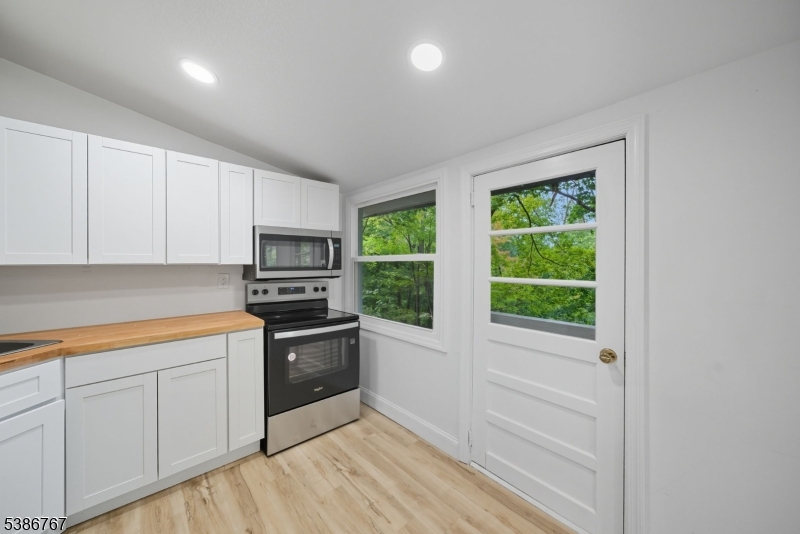330 Springbrook Trail Sparta, NJ 07871 - Photo 13 of 41 a kitchen with granite countertop a stove and a sink