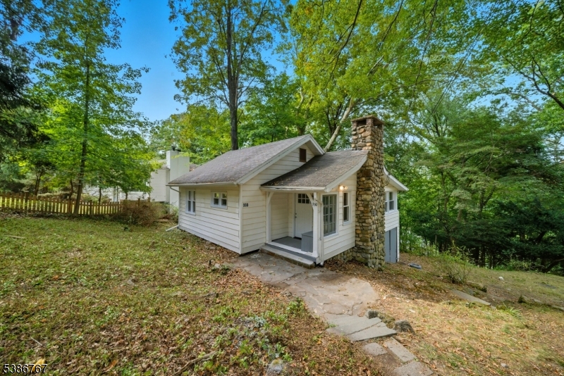 330 Springbrook Trail Sparta, NJ 07871 - Photo 33 of 41 a view of a house with a yard and large trees