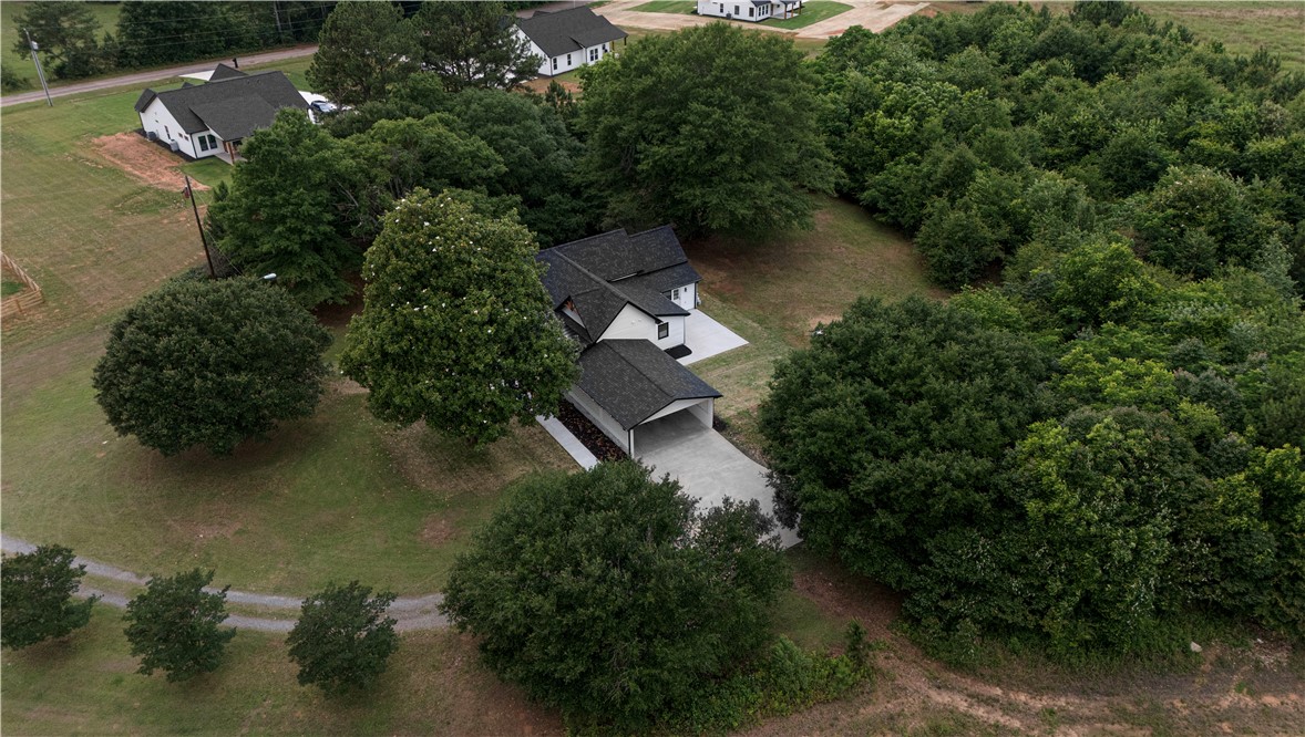 2817 Broadway Lake Road Anderson, SC 29621 - Photo 41 of 41 An aerial perspective showcases a private residence amidst verdant, mature trees, offering peaceful seclusion.
