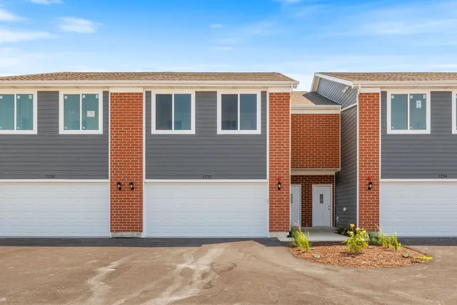 a front view of house with garage