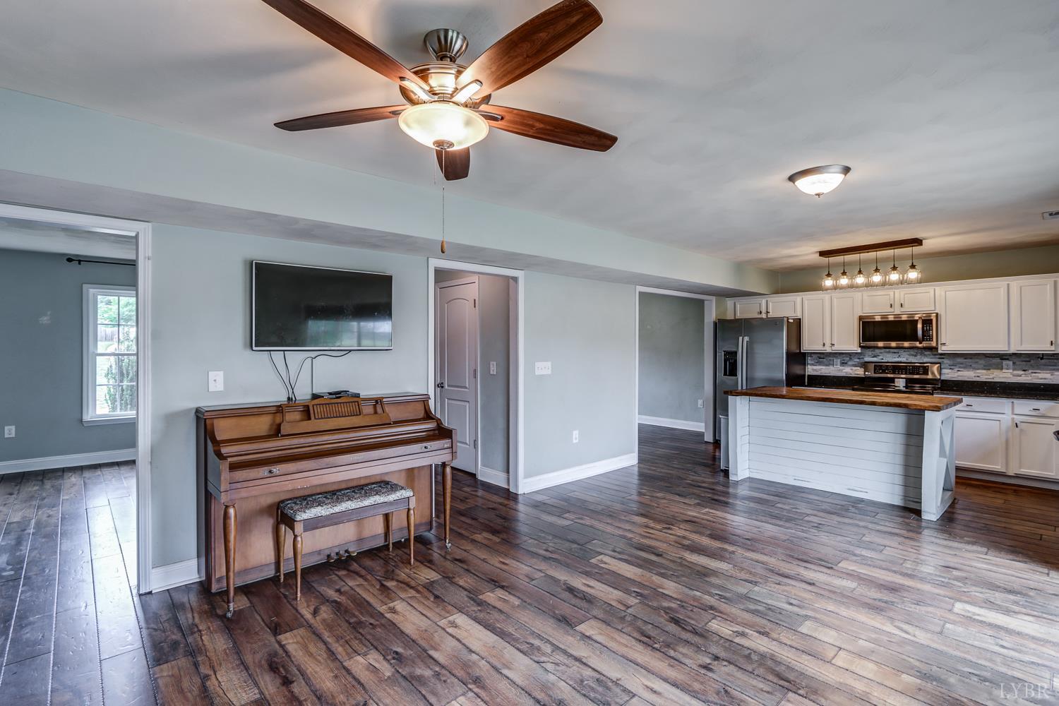 1057 Old Trail Road Forest, VA 24551 - Photo 19 of 49 a living room with furniture and a piano
