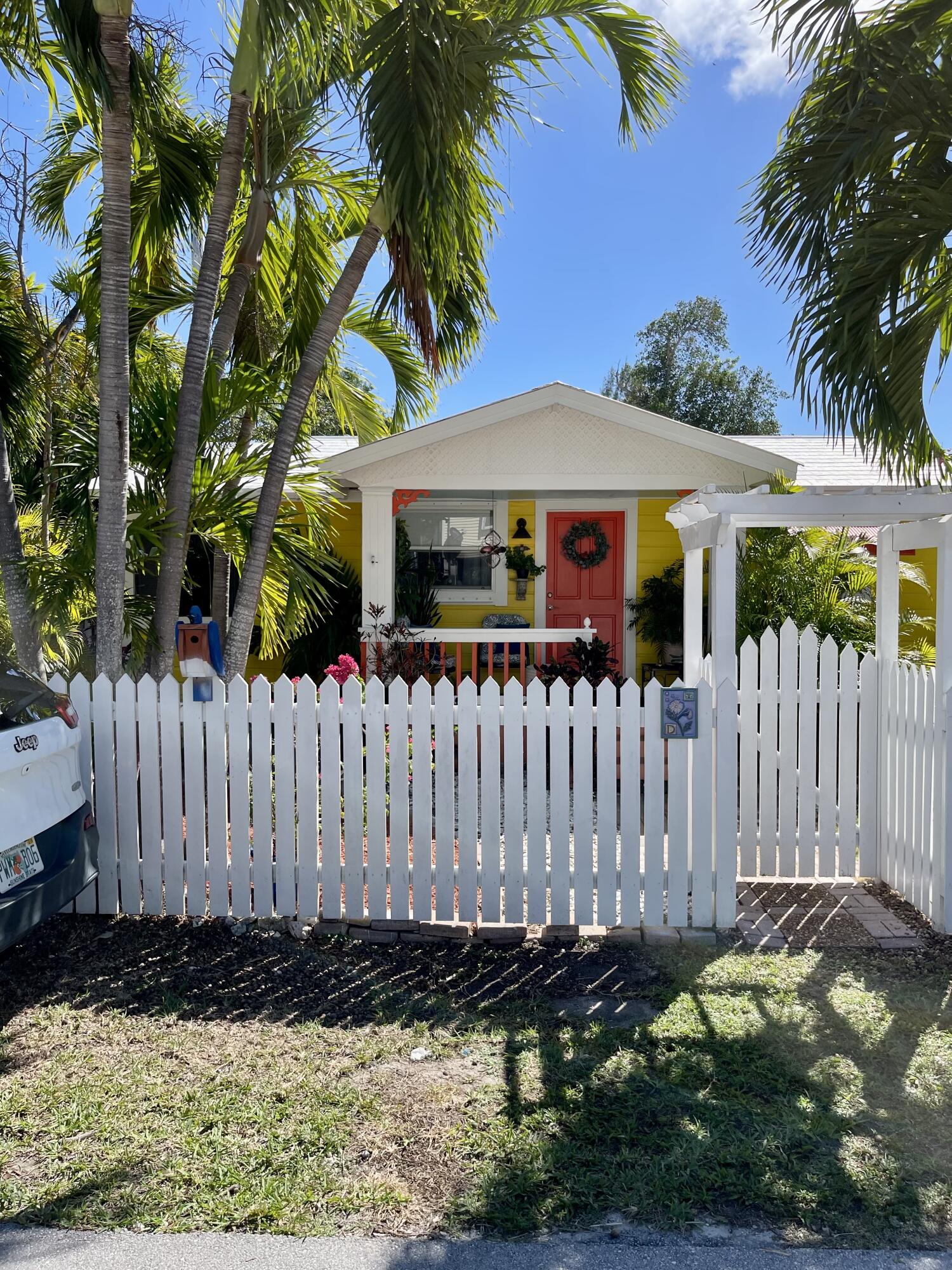 31240 Ave D Big Pine Key, FL 33043 - Photo 1 of 42 a front view of a house with a garden