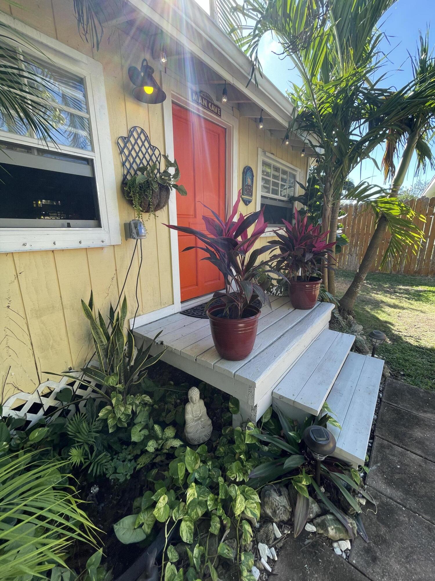 31240 Ave D Big Pine Key, FL 33043 - Photo 15 of 42 a vase of flowers sitting on a table in a patio
