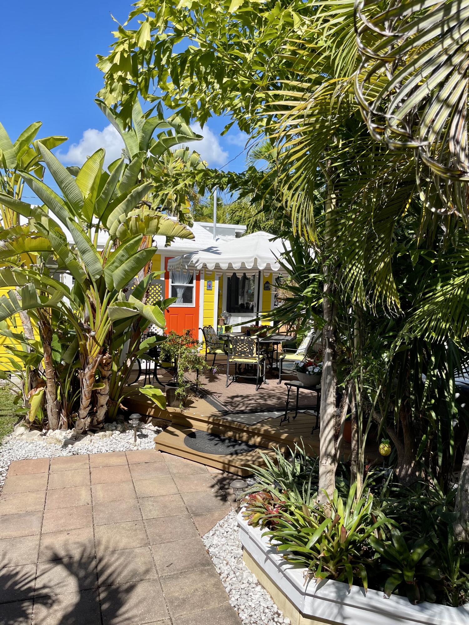 31240 Ave D Big Pine Key, FL 33043 - Photo 22 of 42 a view of a patio with table and chairs and potted plants