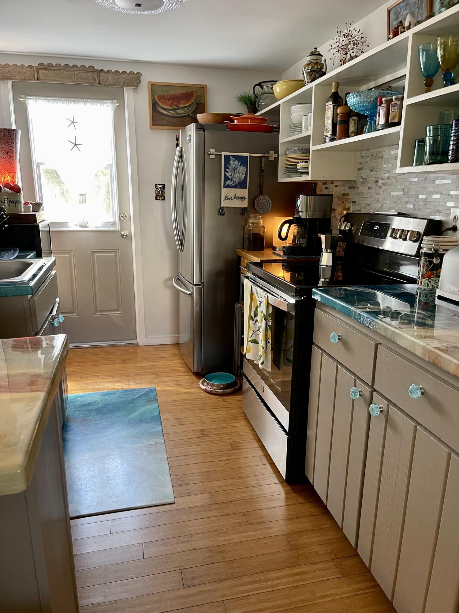 31240 Ave D Big Pine Key, FL 33043 - Photo 41 of 42 a kitchen with stainless steel appliances granite countertop a refrigerator a stove and a sink