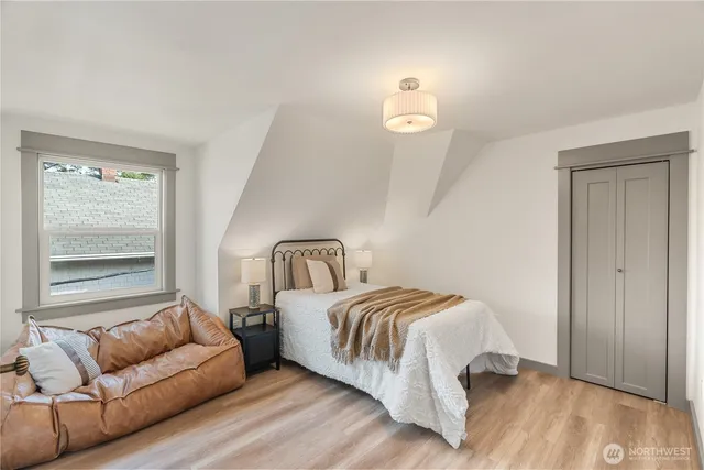 a bedroom with a bed and a couch